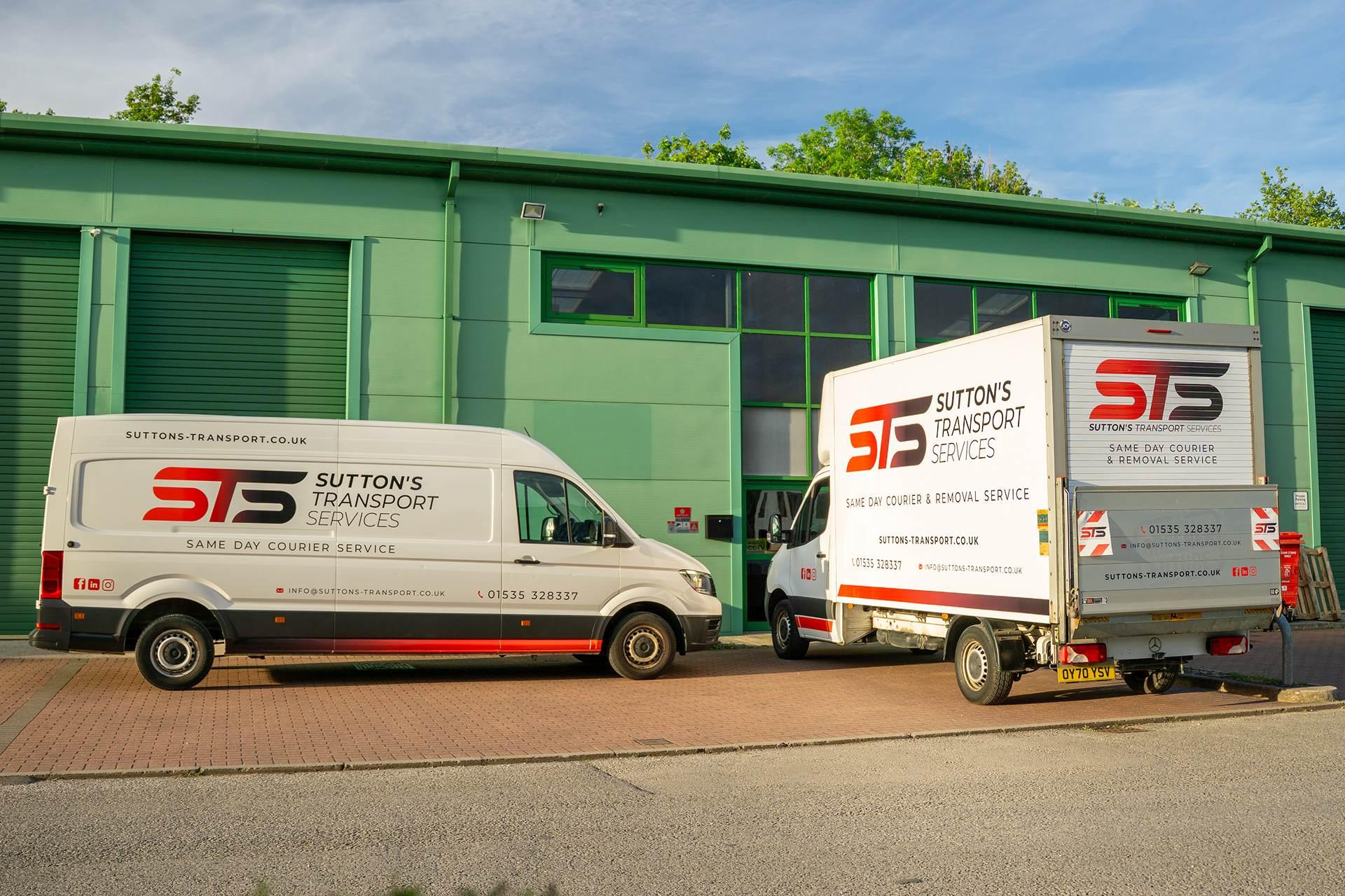 Sutton's transport services van and luton van parked up waiting for a collection